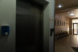 an open door in a room with a hallway at City View 2BR With Balcony, Steps To Cascade And North Avenue l New Building in Yerevan +4 photos