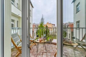 an apartment balcony with a view of a city at Walter&Sons Apartment Centro in Poděbrady