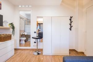 a bedroom with a sliding door leading to a bathroom at Way to Coast in Sant'Egidio del Monte Albino +69 photos