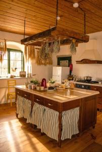a kitchen with a large island in the middle at Tôlluste Villa in Tõlluste +29 photos