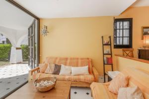 a living room with a couch and a table at Ducado B104 in Pals