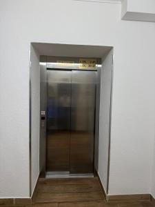 an elevator in a building with a sign on it at HELENA Hotel & Restaurant in Mirow