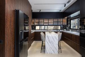 a dining room with a table and chairs at Moonlight Villas Calypso - Sleek Coastal Living by etouri in Koutsourás