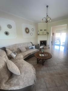 a living room with a couch and a table at Seaside Apartment in Vergia in Vergia
