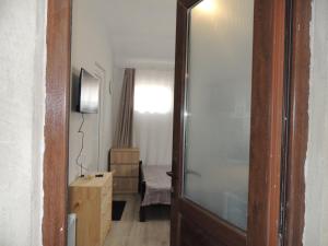 a door leading into a room with a bedroom at Agmashenebeli house 3 in Mtskheta