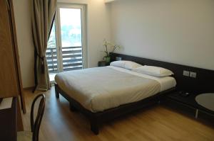 Cama o camas de una habitación en Hotel La Pineta