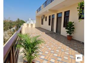 a balcony of a house with plants at Hotel HMI International in Meerut +22 photos