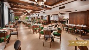 an image of a restaurant with tables and chairs at Alfaresort Palace Chiflika in Chiflik