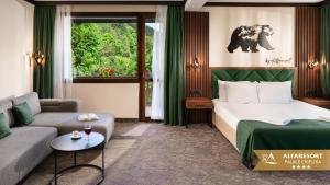 a hotel room with a bed and a couch at Alfaresort Palace Chiflika in Chiflik +77 photos