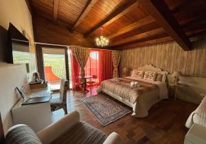 a bedroom with a bed and a couch in a room at B&B Villa del Sole Relais in Agrigento +108 photos