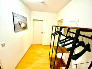 a room with a bunch of wine bottles on a shelf at Weimar Cityappartement in Weimar