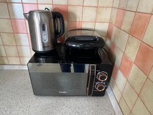 a coffee maker sitting on top of a counter at Casa del Mar 2-Sea view Vollga, 2BR in Durrës