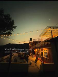 a house with a string of lights above it at TheLocals HomeStay in Dhulikhel