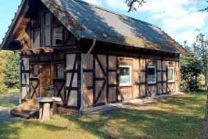 a log cabin with a bench in front of it at Villa Landidyll mit wunderschönem-seperatem Wellnessbereich in Joachimsthal