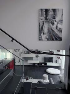 a black and white room with a stair case at Ailiv Room - Lovely Room in Capriasca in Arni Alp +41 photos