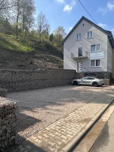 a car parked in front of a house at Gästehaus am Weinberg in Oberheimbach