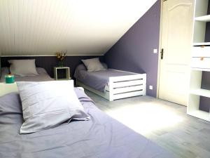 a bedroom with two beds in a attic at La Borieta in Labastide-de-Penne