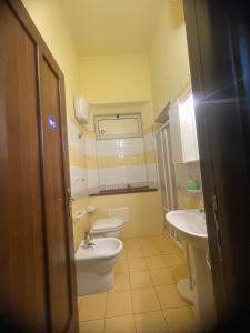 a bathroom with two toilets and a sink at Mappet B&B in Melito di Porto Salvo +8 photos