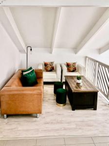 a living room with a couch and a table at Dolphin View 34 in Langstrand +11 photos