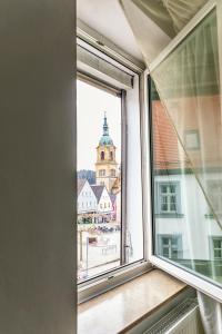 a window with a view of a building at Ferienwohnung Otto in Pegnitz