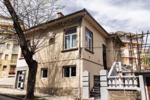 a house with a tree in front of it at Family Boutique in Veliko Tŭrnovo