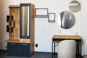 a dressing room with a mirror and a desk at Family Boutique in Veliko Tŭrnovo