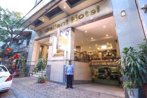 a man standing in front of a store at Gllant Villa Hà Nội in Hanoi