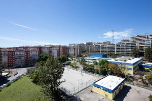 an aerial view of a city with tall buildings at Colinas Premium 3BR in Odivelas