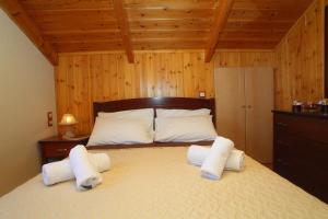 Ένα ή περισσότερα κρεβάτια σε δωμάτιο στο Aggelina +37 φωτογραφίες