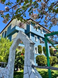 a building with a statue in front of it at Paradise House in Pamukkale