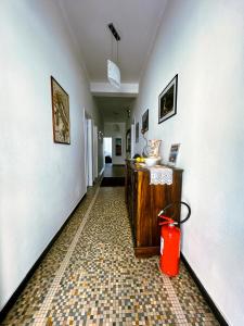 a hallway with a red trash can in a room at Affittacamere Giulia in Vernazza +35 photos
