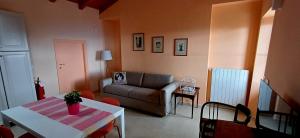 a living room with a couch and a table at Casa del Moro al Sacro Monte app1 in Varese