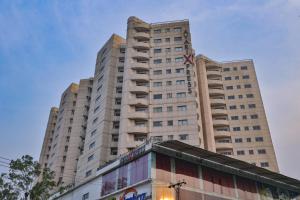 a tall white building with a flag on it at Avari Xpress Gulberg in Lahore