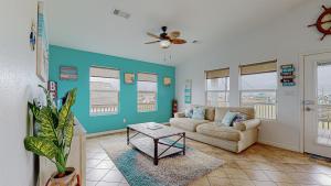 a living room with a couch and a table at Casa Siwichi home in Crystal Beach