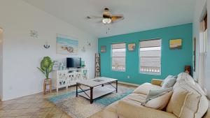 a living room with a couch and a table at Casa Siwichi home in Crystal Beach