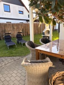 a table and chairs sitting on a patio at ZweiundMeer Bungalow 1 in Wiek auf Rügen