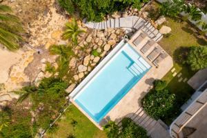 an overhead view of a swimming pool next to a beach at Hortensia Luxury Beach Villa in Chaloklum