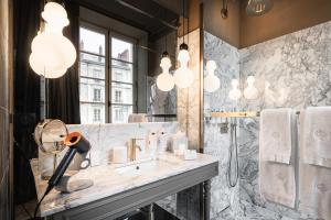 a bathroom with a sink and a mirror at Maison Maubreuil in Nantes +67 photos