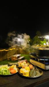 two plates of food on top of a table at Suka Camping - Bentong in Bentong +29 photos