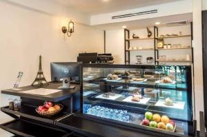 a bakery with a display case filled with food at The Westerly Riverside Hotel in Phnom Penh