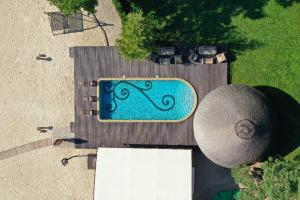 an overhead view of a swimming pool in a yard at Secret River Rooms in Pereiaslav-Khmelnytskyi +27 photos