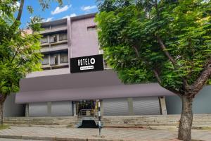 a building with a sign for a hotel at Super Hotel O MG Road Raniganj Formerly Holiday Hotel in Hyderabad +57 photos