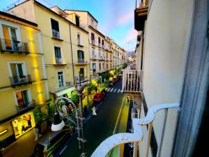 a view from a balcony of a street with buildings at Palazzo Spasiano rooms - SORRENTO CENTER in Sorrento