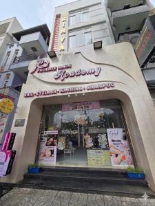 a restaurant with a sign on the front of a building at Nhà nghỉ KIM VÀNG in Phú Quốc