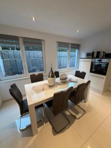 a kitchen and dining room with a table and chairs at Beautiful living in Schönaich
