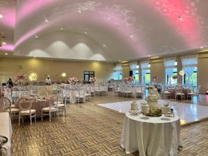 a ballroom with tables and chairs and a room filled with tables and chairsktop at Sawela Lodges in Naivasha +77 photos