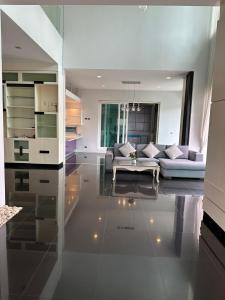 a living room with a couch and a table at Villa Worawan Pool Villa Bo Phut in Nathon Bay