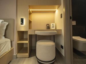 a small bathroom with a sink and a bed at Luxury 2br Apt & Pool access in Panama City