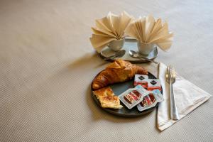a plate of food on a table with a plate of food at Hotel Genova Liberty in Genoa