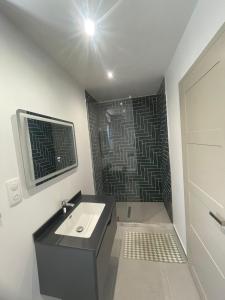 a bathroom with a sink and a shower at Contemporary villa with pool and sea view in Poulithra +21 photos